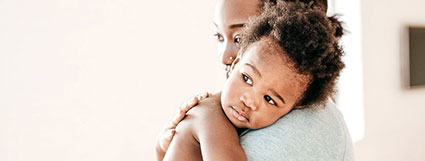 mom holding toddler